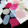 A collection of flexible silicone resin molds in various colors and shapes including heart, round, oval, and rectangle forms.