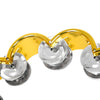 A colorful double-layer tambourine with metal bells, featuring gold and silver components.