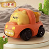 An orange push and go toy car shaped like a bear, used as a rattle for babies.