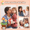 A man and a girl sharing a kiss while holding a handmade crochet doll with flower accents as a gift idea.