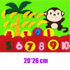 A felt board showing numbers 1 through 10 with associated fruit shapes like bananas and a monkey.
