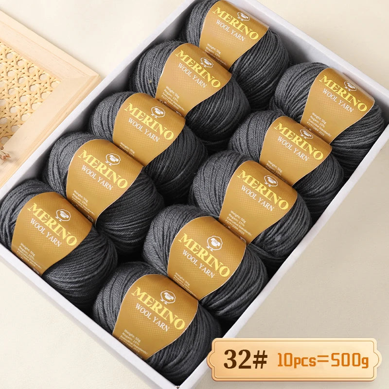 A box of Merino wool yarn balls with yellow labels showing the weight and quantity.