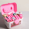 A pink plastic box filled with a kids doctor play set featuring various medical accessories and tools.