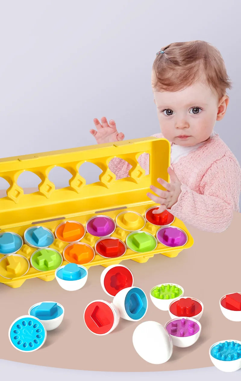 A baby is interacting with a yellow Montessori sensory egg sorter toy and various colored plastic eggs.