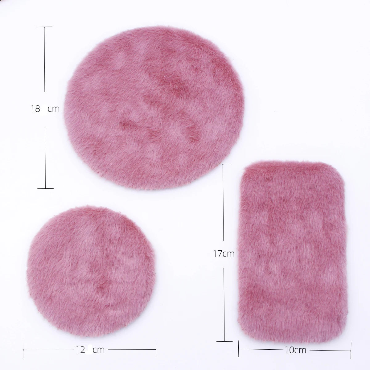 A pink handwoven miniature carpet mat with a round and rectangular shape for dollhouse decor
