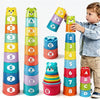 A child is playing with a colorful educational stacking cup game featuring numbers, letters, and shapes.