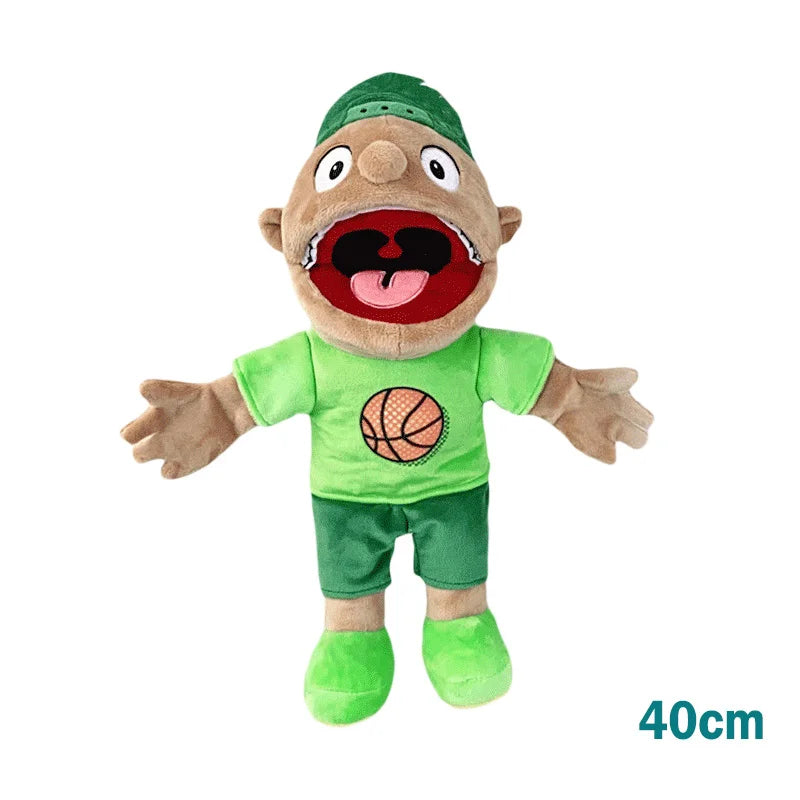A realistic plush hand puppet of a green-skinned character wearing a green shirt and shorts.