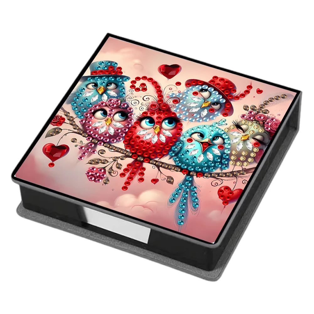 A leather diamond painting kit box featuring colorful birds and hearts on a pink background.