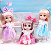 Three pink and blonde articulated princess dolls with dresses and bows are displayed against a light blue background.