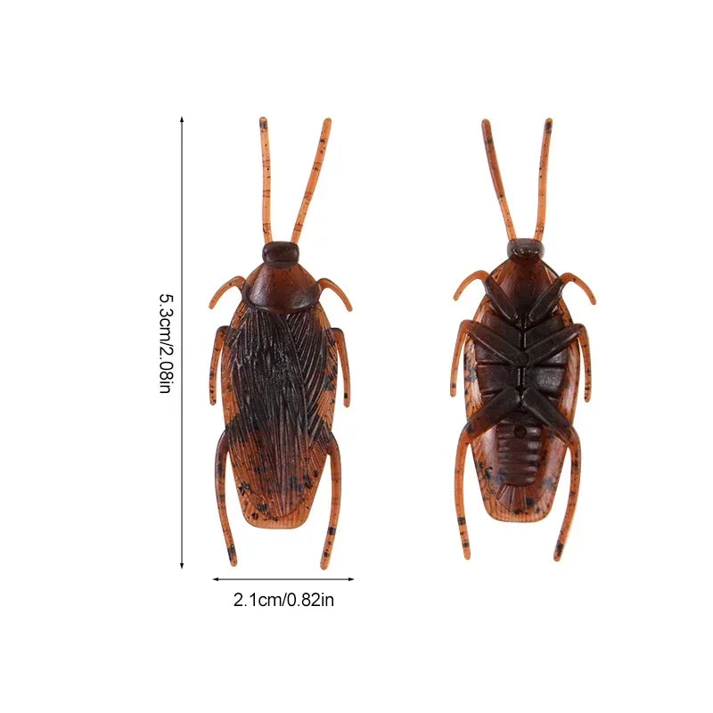 A realistic fake cockroach prop with antennae shown from above and below.