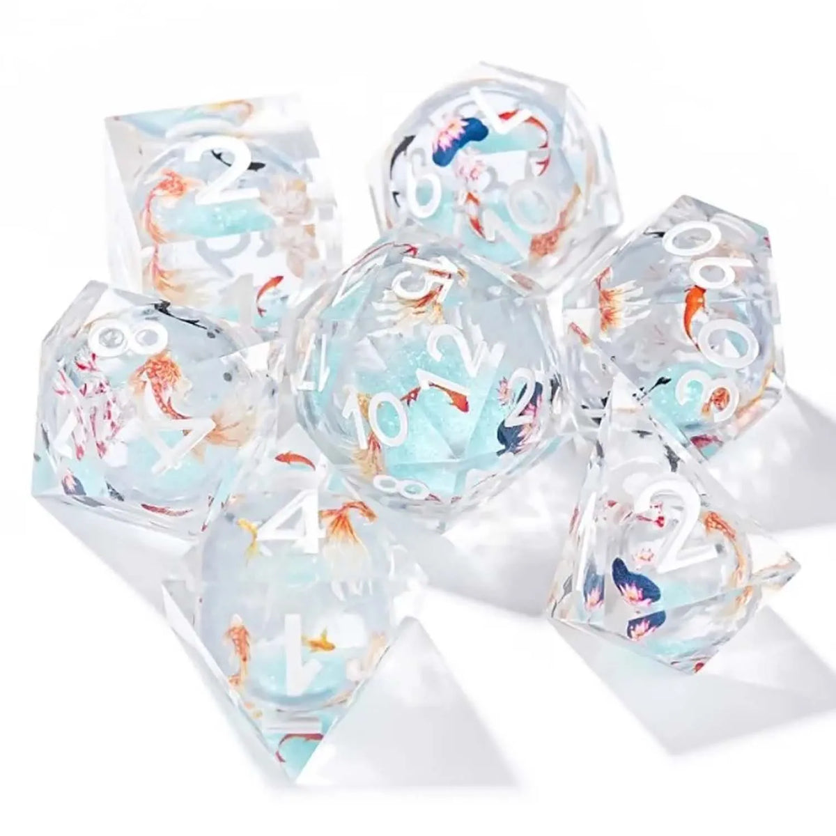 A set of seven clear resin polyhedral dice featuring pink floral butterfly designs for tabletop role-playing games