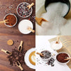 A collection of natural wooden scoop spoons is shown alongside various powders and coffee beans.