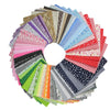 A circular display of various colorful cotton fabric squares for quilting and patchwork.