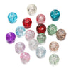A collection of various colored glass crackle beads for jewelry making, including blue, pink, purple, and green shades.