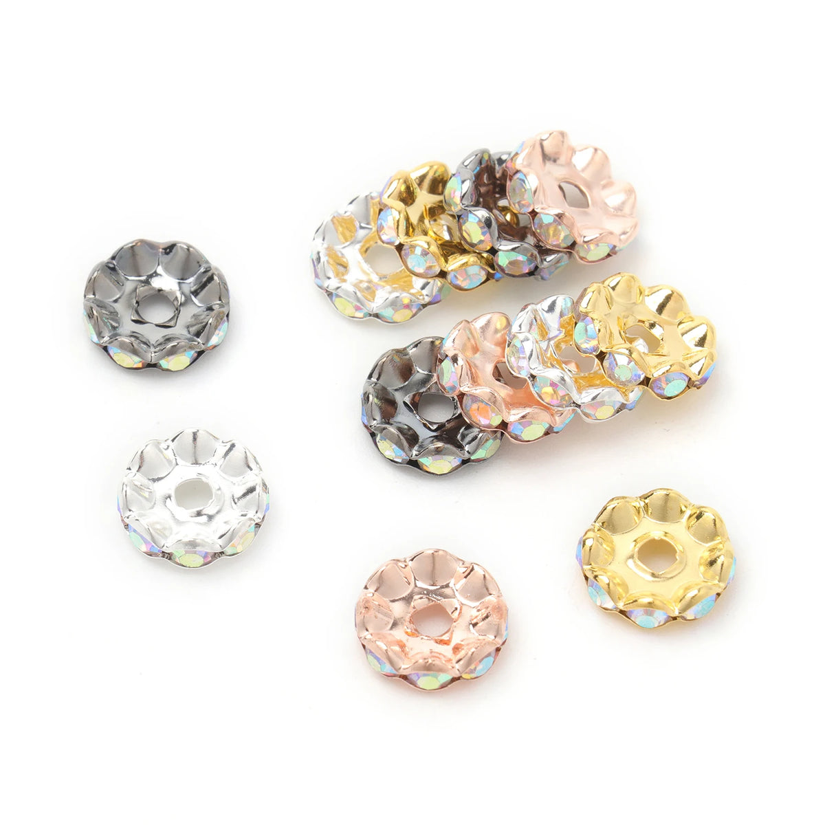A collection of 12mm crystal rhinestone spacer beads in gold and rose gold tones.