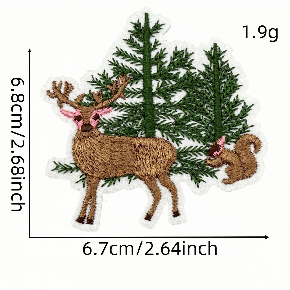 An iron-on patch featuring a cartoon deer with antlers surrounded by evergreen trees.
