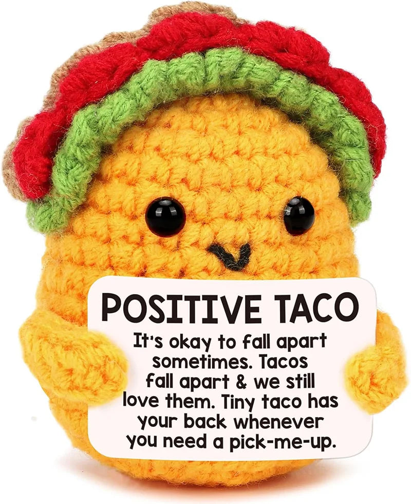 Handmade crochet taco plush toy with a colorful hat and a positive message