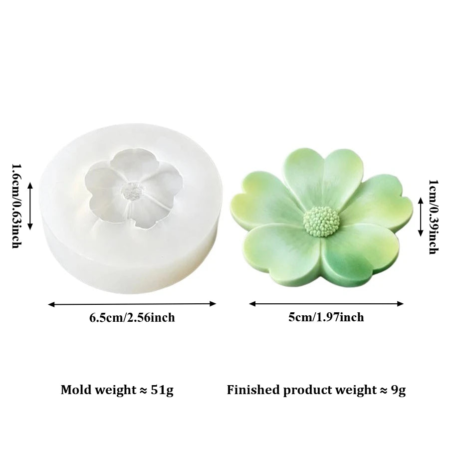 A white silicone mold shaped like a flower, used for candle making or soap crafting.