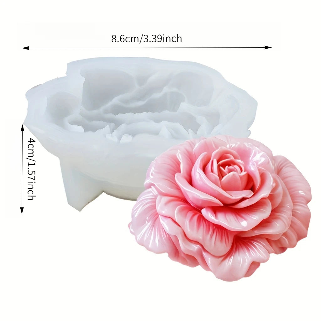 A pink silicone mold shaped like a rose flower for crafting and baking.