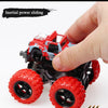 A hand holds a red and blue friction-powered monster truck toy with large tires, demonstrating its sliding feature.