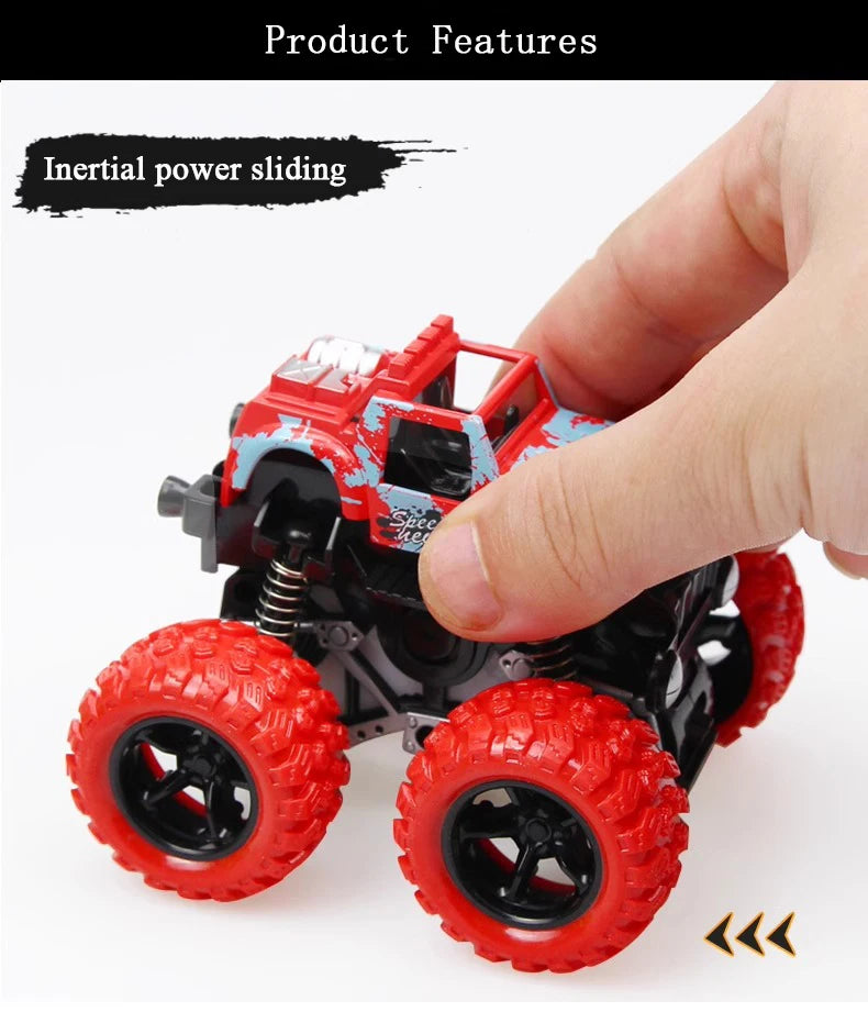A hand holds a red and blue friction-powered monster truck toy with large tires, demonstrating its sliding feature.