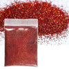 A sealed bag of fine, holographic red glitter powder next to a pile of loose red glitter.
