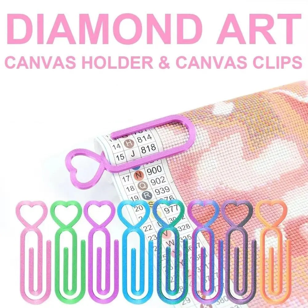 A collection of heart-shaped canvas holder and canvas clips in various shades of pink, green, and blue.