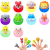 A hand is holding ten soft rubber animal finger puppets in various colors and shapes.