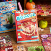 A collection of Japanese vintage kawaii sticker packs for scrapbooking and journaling displayed on a wooden surface.