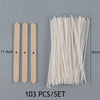 A set of 103 pre-waxed cotton candle wicks with metal sustainers shown next to a ruler for scale.