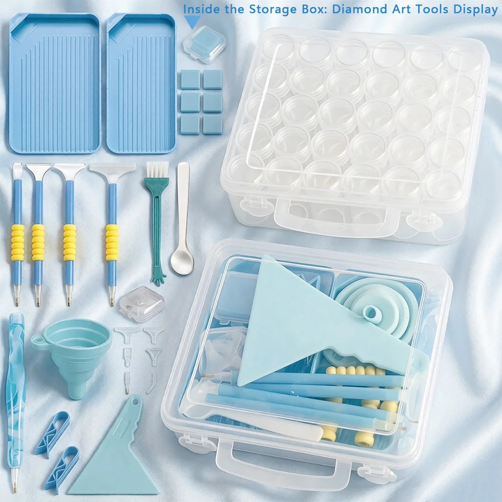 A clear storage box displays diamond art tools including dotting pens, trays, and a funnel.