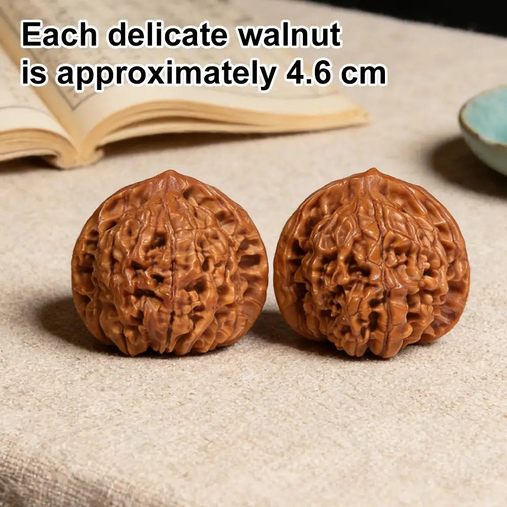 Two hand-polished walnuts resting on a light fabric with text indicating each walnut is approximately 4.6 cm.