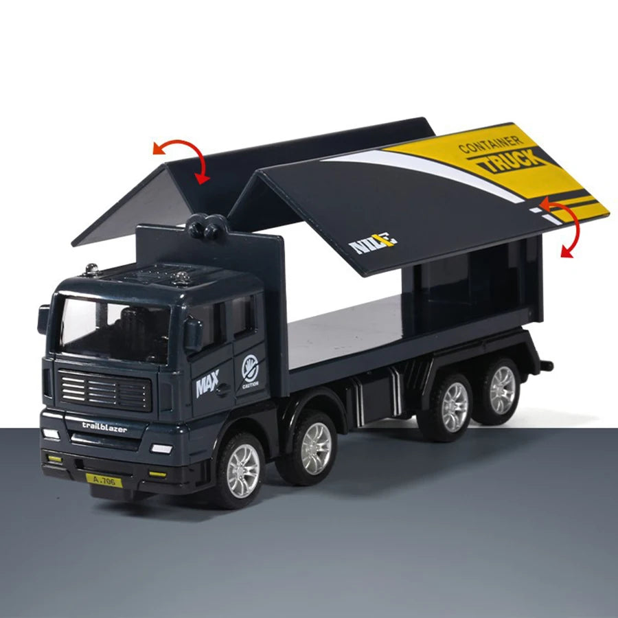 A black pull-back container truck toy with a yellow roof and a trailer, shown from the side.