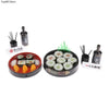 A miniature Japanese sushi set featuring various rolls and serving tools for a dollhouse kitchen.