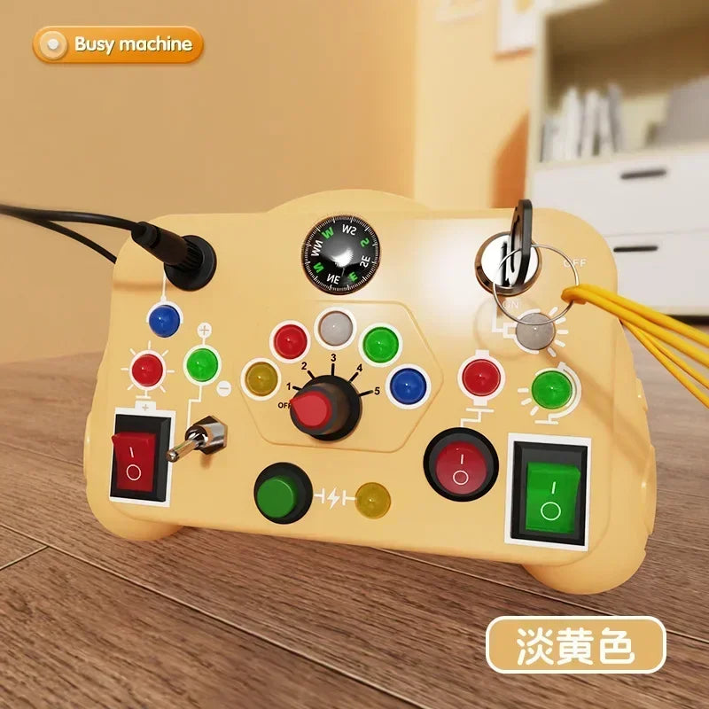 A yellow Montessori busy board with various switches and an LED light, used for toddlers.