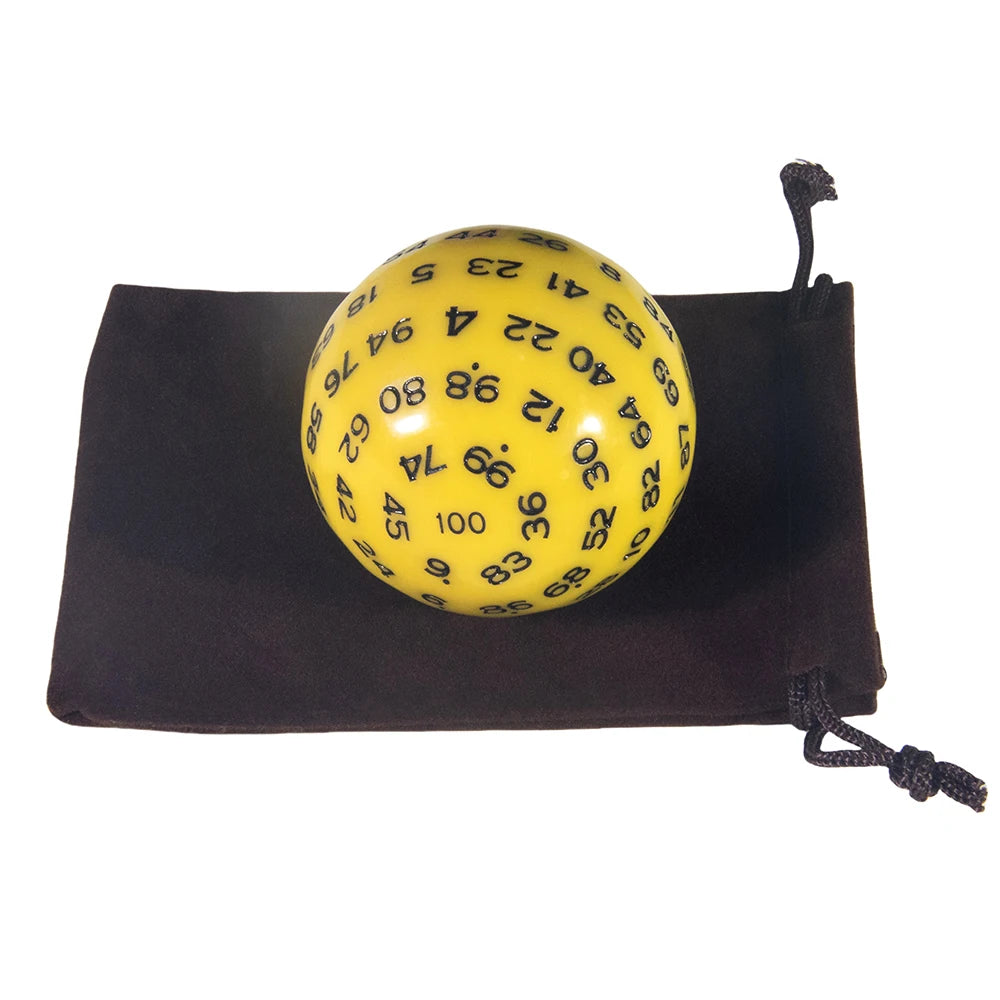 A yellow 100-sided polyhedral die is resting in a dark brown storage bag.