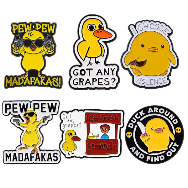 Set of funny yellow duck enamel lapel pins featuring various humorous phrases like PEDEW and GOD ANY GRAPES