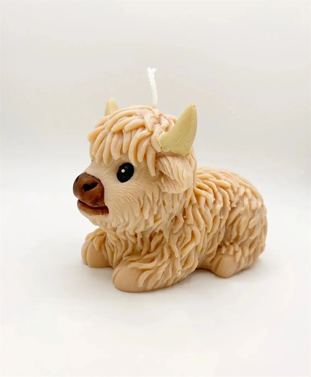 A light beige silicone mold shaped like a Highland cow head for crafting.
