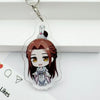 A clear acrylic pendant featuring an anime-style character with brown hair and a traditional outfit, attached to a silver key