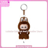 A brown plush doll resembling a rabbit with large ears and a silver keyring attached.