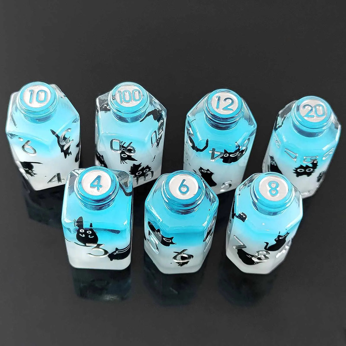 A set of seven floral resin potion bottles shaped like polyhedral dice with numbers 4, 6, 10, 12, 20, and 100.