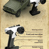 A green 1/12 scale RC rock crawler truck with a white steering control and battery compartment components.
