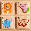 Four wooden jigsaw puzzles featuring Lion, Koala, Elephant, and Monkey animals.