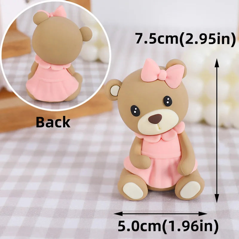 A light brown 3D bear cake topper with pink accents, shown from the back and a side view.