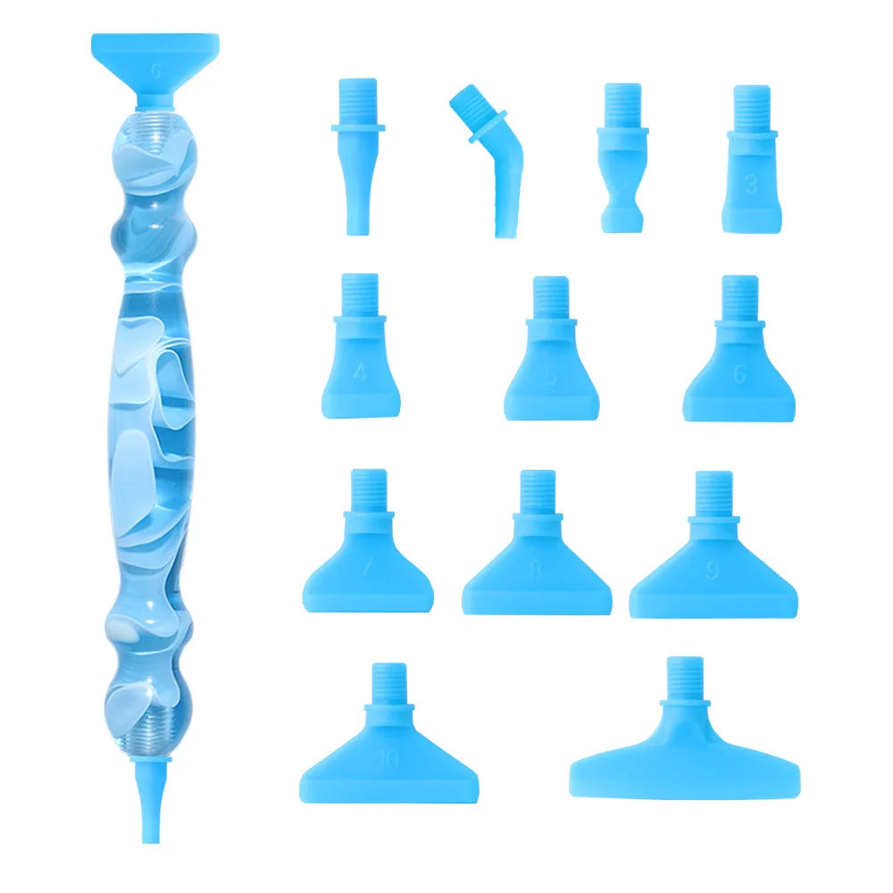 A collection of twelve interchangeable tips for a Diamond Art pen kit, shown in various shades of light blue.