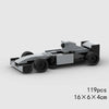 A gray classic rally car building block set with various components.