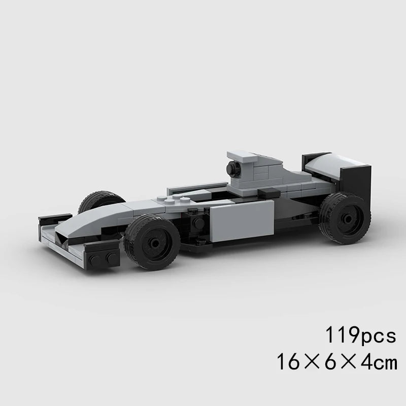 A gray classic rally car building block set with various components.