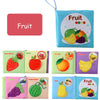 A set of soft fabric baby books featuring various fruits like strawberry, apple, orange, banana, grapes, watermelon, and pear