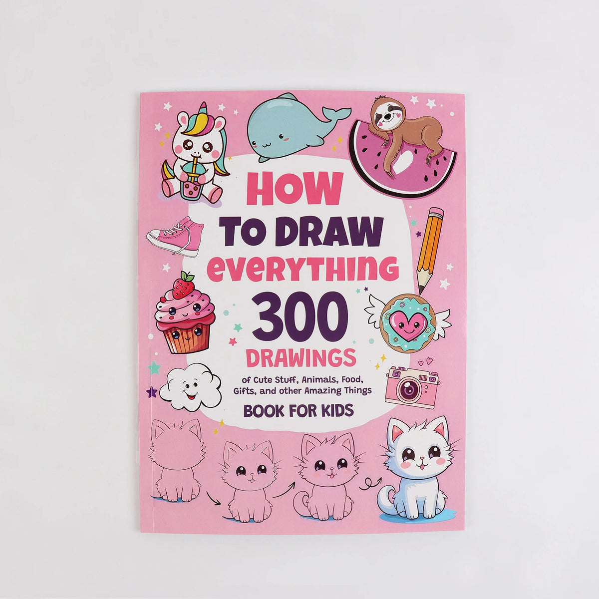 A pink children's book titled How to Draw Everything 300 Drawings featuring cute animals and objects.
