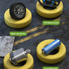 A set of remote control drift racing tires, a battery, and a remote control are displayed on a dark surface.